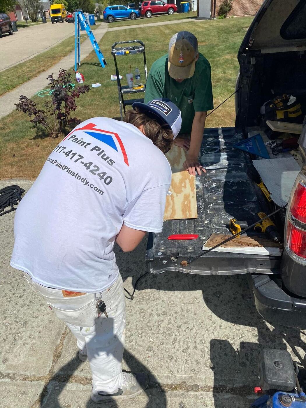 Paint Plus Indy crew prepping materials at the work truck