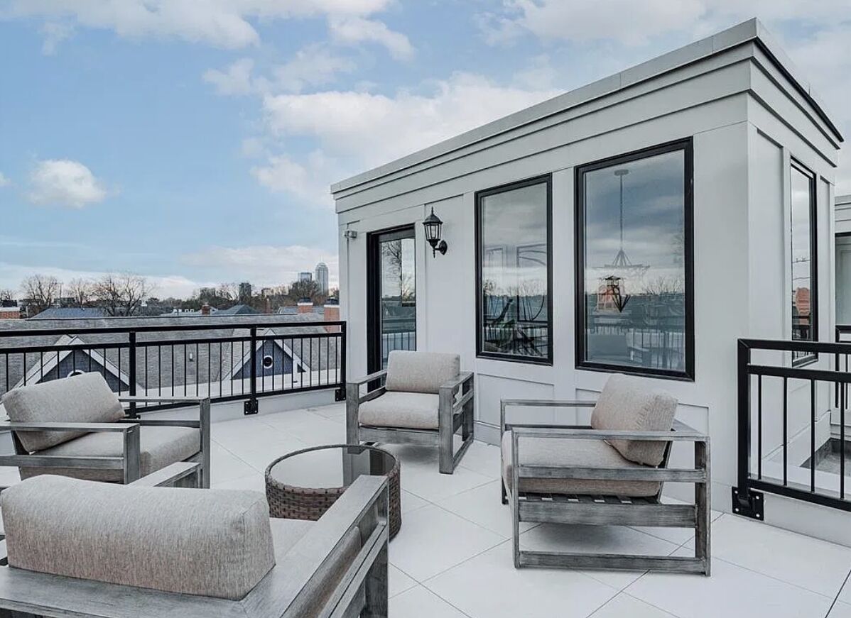 Rooftop terrace of a modern home with crisp white exterior paint